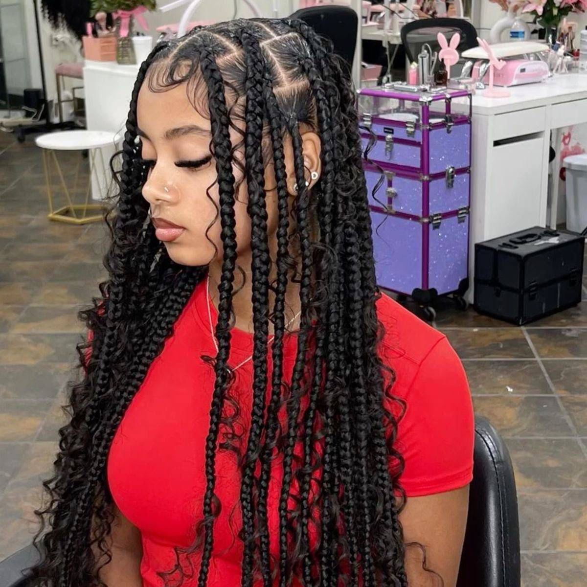 Long black braids with face-framing curls