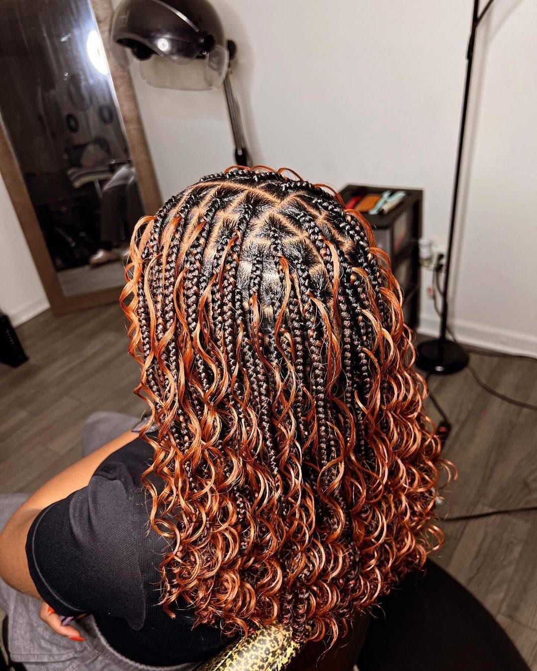 Boho braids with warm copper curls